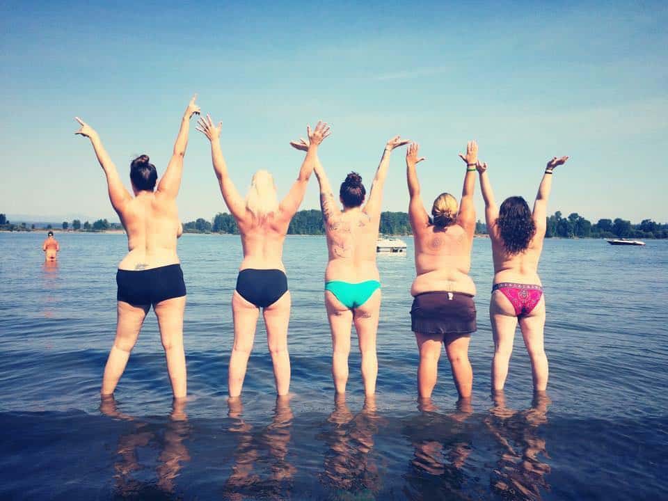 Girls Who Travel | Community members having topless fun at the beach