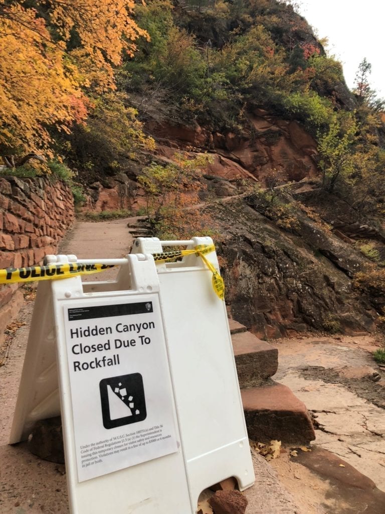 A "closed" sign sits in front of one of the trails in Zion | Girls Who Travel