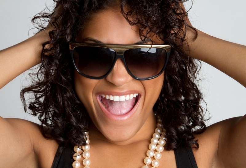 Happy black woman wearing sunglasses