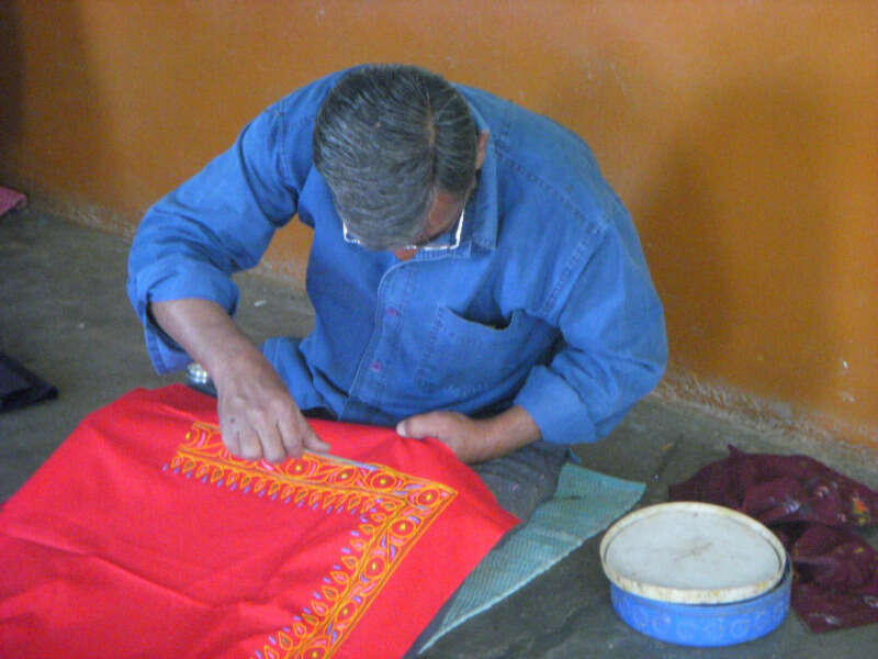 Man doing Rogan art Girls Who Travel | How I Came to Own a Piece of Rogan Art